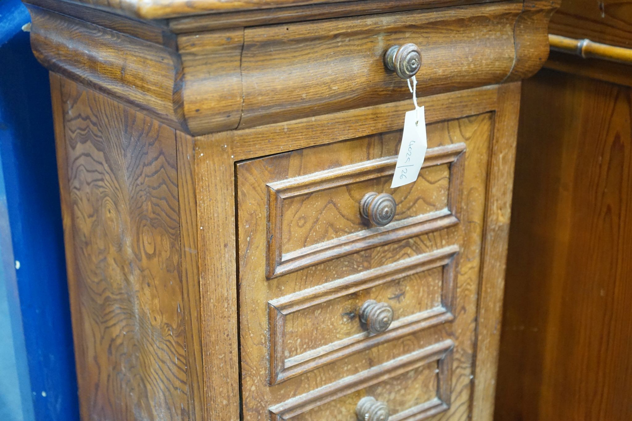 A 19th century French elm bedside cabinet with dummy drawer front, width 47cm, depth 36cm, height 76cm